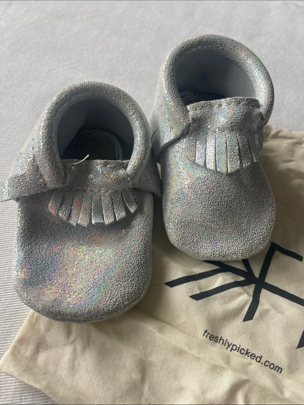 NWOT Freshly Picked Size 2 Silver Holographic Moccasins